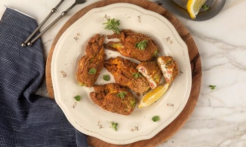 Κολοκυθοανθοί γεμιστοί με τυρί κρέμα και πιπεριές Φλωρίνης στον φούρνο