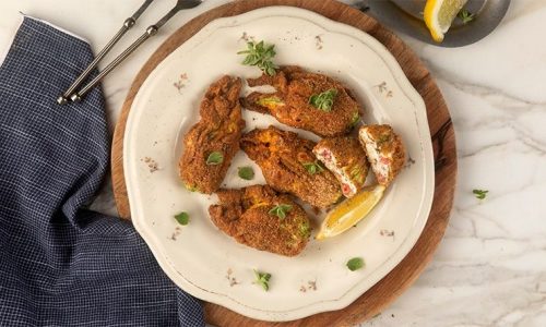 Κολοκυθοανθοί γεμιστοί με τυρί κρέμα και πιπεριές Φλωρίνης στον φούρνο