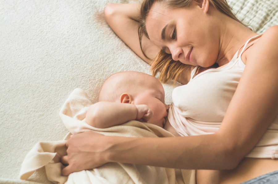 Portrait Of A Mom And Breast Feeding Baby. Concept Breast Feeding.